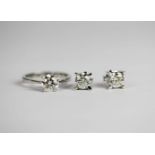 Solitaire Diamond ring and Pair of Diamond stud earrings, ring is set with 1 round brilliant cut