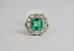 Emerald and Diamond ring, set with 1 cushion cut emerald approximately 2.45ct, 12 claw set,