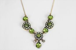 Diamond, Peridot and Seed Pearl necklace, set with 8 peridots, 2 diamonds and 30 seed pearls,