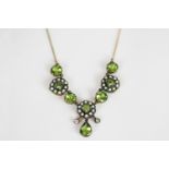 Diamond, Peridot and Seed Pearl necklace, set with 8 peridots, 2 diamonds and 30 seed pearls,