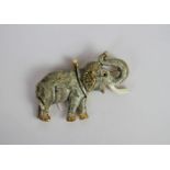 Enamel Elephant brooch, stone set ears and eyes, 6x4cms, continental marks, tested as 18ct,