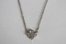 Cariter diamond necklace, flower head shaped mount set with four brilliant cut diamonds to each