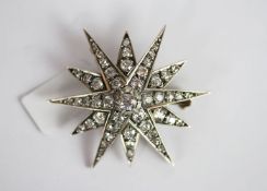 Edwardian old cut diamond star burst brooch, central old cut diamond approximately 4.5mm diameter,