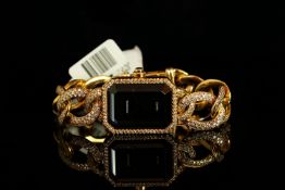 LADIES 18K CHANEL 1987,FULLY LOADED DIAMONDS, square, black dial with gold baton hands, diamond