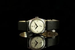 MID SIZE ROLEX SHOCK RESISTING WRISTWATCH CIRCA 1925, circular off white dial with black minute