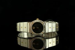 LADIES MOVADO 373.020 DRESS WATCH, round, black dial with gold dart hands,no markes with gold dot at