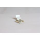 18CT FIVE STONE CROSS RING ,ESTIMATED AT 1.00CT TOTAL, stamped 18ct, total weight 3.10 gms , size