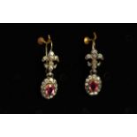 Early 20th Century Paste set earrings, pink oval cut stone to center cluster, fleur de lis tops,