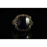 Sapphire dress ring, large cushion cut dark blue sapphire, 12.5x11.3mm, mounted in a pierced work