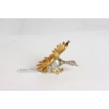 Marbe Pearl and diamond set bird brooch, Marbe pearl body, diamond set neck with ruby eyes, gold