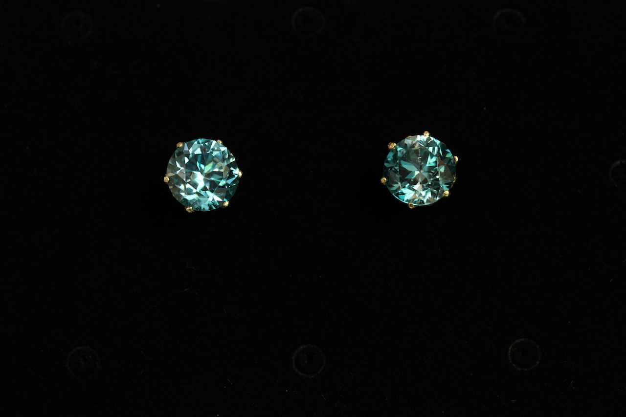 Pair of Blue Zircon stud earrings, 9.1mm round cut Blue Zircon stones each six claw set in yellow