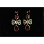 Early 20th Century Garnet and Paste set earrings, white paste stones to bow with a foil backed