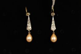 Pearl and diamond drop earrings, a single peach coloured drop pearl suspended from old cut diamond