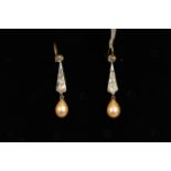 Pearl and diamond drop earrings, a single peach coloured drop pearl suspended from old cut diamond