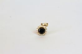 14K YELLOW GOLD BLACK DIAMOND AND WHITE DIAMOND PENDANT, centre stone 1.37ct natural black