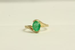 14K YELLOW GOLD OVAL CUT EMERALD ANDPAVE SET DIAMOND CLUSTER RING,centre stone estimated as 1.13ct,