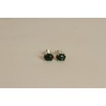 Pair of Black Opal stud earrings, each set with an oval cut black opal, 4 claw set, stamped sterling