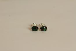 Pair of Black Opal stud earrings, each set with an oval cut black opal, 4 claw set, stamped sterling