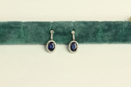 14K WHITE GOLD SAPPHIRE AND DIAMOND CLUSTER DROP EARRINGS, centre stones estimated as 1.65ct