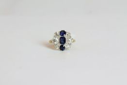 Sapphire and Diamond ring, set with 3 sapphires totalling approximately 1.43ct, surrounded by 6