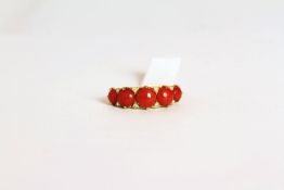 Coral ring, set with 5 graduated coral stones, finger size M.