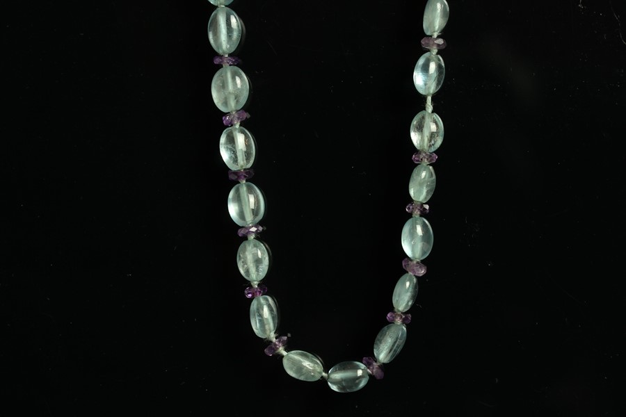 9CT BLUE TOPAZ AND AMETHYST NECKLACE , 9ct tube clasp, length, length estimated as 66 cms