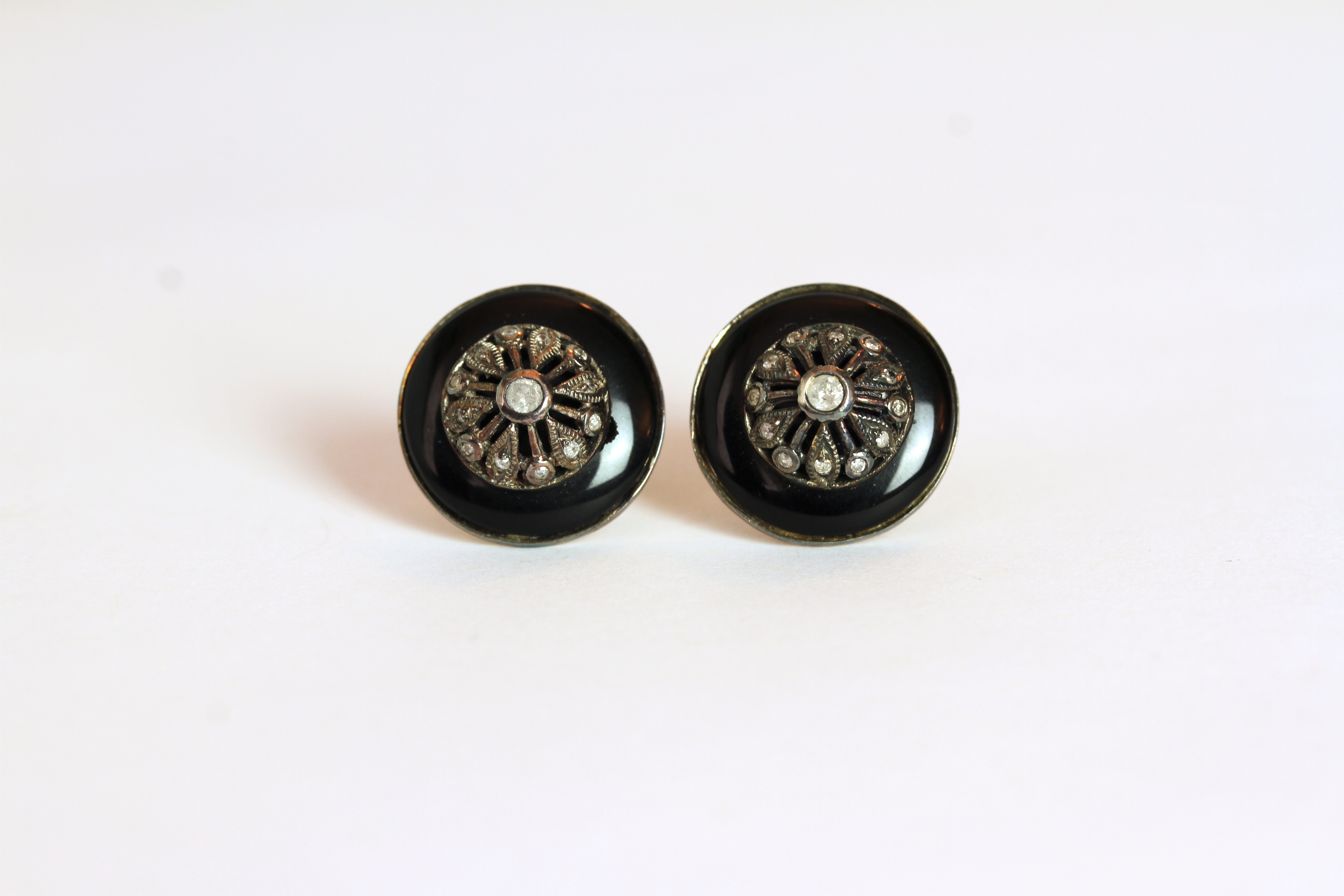 Pair of Diamond and Black Enamel stud earrings, each set with 13 diamonds, surrounded by black