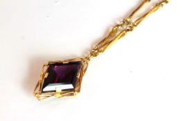 Modernist Amethyst 18ct necklace, large diamond cut Amethyst mounted within 18ct wire work frame,