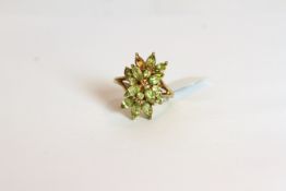 9CT GREEN STONE PETAL RING, stamped 9ct, total weight 5.5 gms, ring size P, please note a stone is