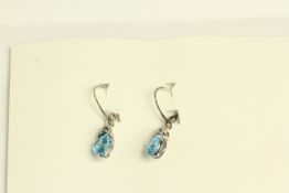 10K WHITE GOLD TRILLIANT CUT TOPAZ AND DIAMOND EARRINGS,deep intense blue stones estimated at 3.00ct