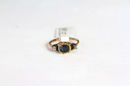 Georgian Sapphire and Diamond, central later sapphire in an old georgian closed back setting, a