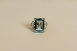 Aquamarine and Diamond ring, set with an emerald cut aquamarine measuring approximately 12.88ct, 4