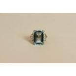 Aquamarine and Diamond ring, set with an emerald cut aquamarine measuring approximately 12.88ct, 4