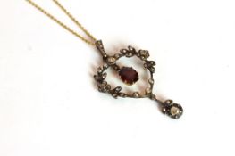 Garnet and rose cut diamond pendant and chain, oval cut red garnet suspended within a diamond set