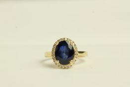 14K SAPPHIRE AND DIAMOND RING,centre stone estimated 2.16ct, dark blue, included, diamonds estimated