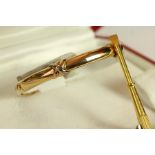 18K CARTIER TRINITY BANGLE D36264 SIZE 16,comes with box and screwdriver total weight 28.8gms.