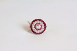 Ruby and Diamond dress ring, set with a central old-cut diamond, a halo of rubies, a halo of