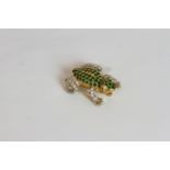 Emerald and Diamond set frog brooch, body set with emeralds totalling approximately 1.15ct, arms and