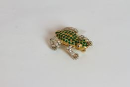 Emerald and Diamond set frog brooch, body set with emeralds totalling approximately 1.15ct, arms and