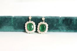 14K EMERALD AND DIAMOND DROP EARRINGS, centre stones estimated as 5.80ct total,medium green,