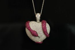 18K DHAMANI SNAKE PENDANT ,set with estimated 5.18ct of natural diamonds, 4.84ct of natural rubies