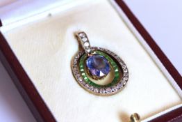 Sapphire, Tsavorite Garnet and Diamond set pendant, set with 1 oval cut sapphire approximately 2.