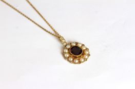 Victorian Garnet, Pearl and Diamond pendant and chain, central oval cushion cut garnet, a border