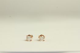 14K ROSE GOLD 4 CLAW DIAMOND STUD EARRINGS, estimated as 0.59ct total, colour G and clarity I1.