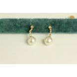 Pair of Pearl and Diamond drop earrings, set with 2 South Sea pearls