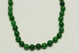 Jade bead necklace, approximately 6mm Jade beads strung knotted, a diamond set clasp,