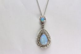 Luke Stockley Opal and Diamond Pendant, set with 2 opal stones, claw set, surrounded by diamonds