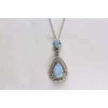 Luke Stockley Opal and Diamond Pendant, set with 2 opal stones, claw set, surrounded by diamonds