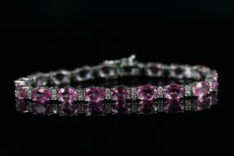 Natural Pink Sapphire and Diamond bracelet, set with 19 oval cut pink sapphires totalling 15.75ct