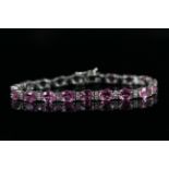 Natural Pink Sapphire and Diamond bracelet, set with 19 oval cut pink sapphires totalling 15.75ct